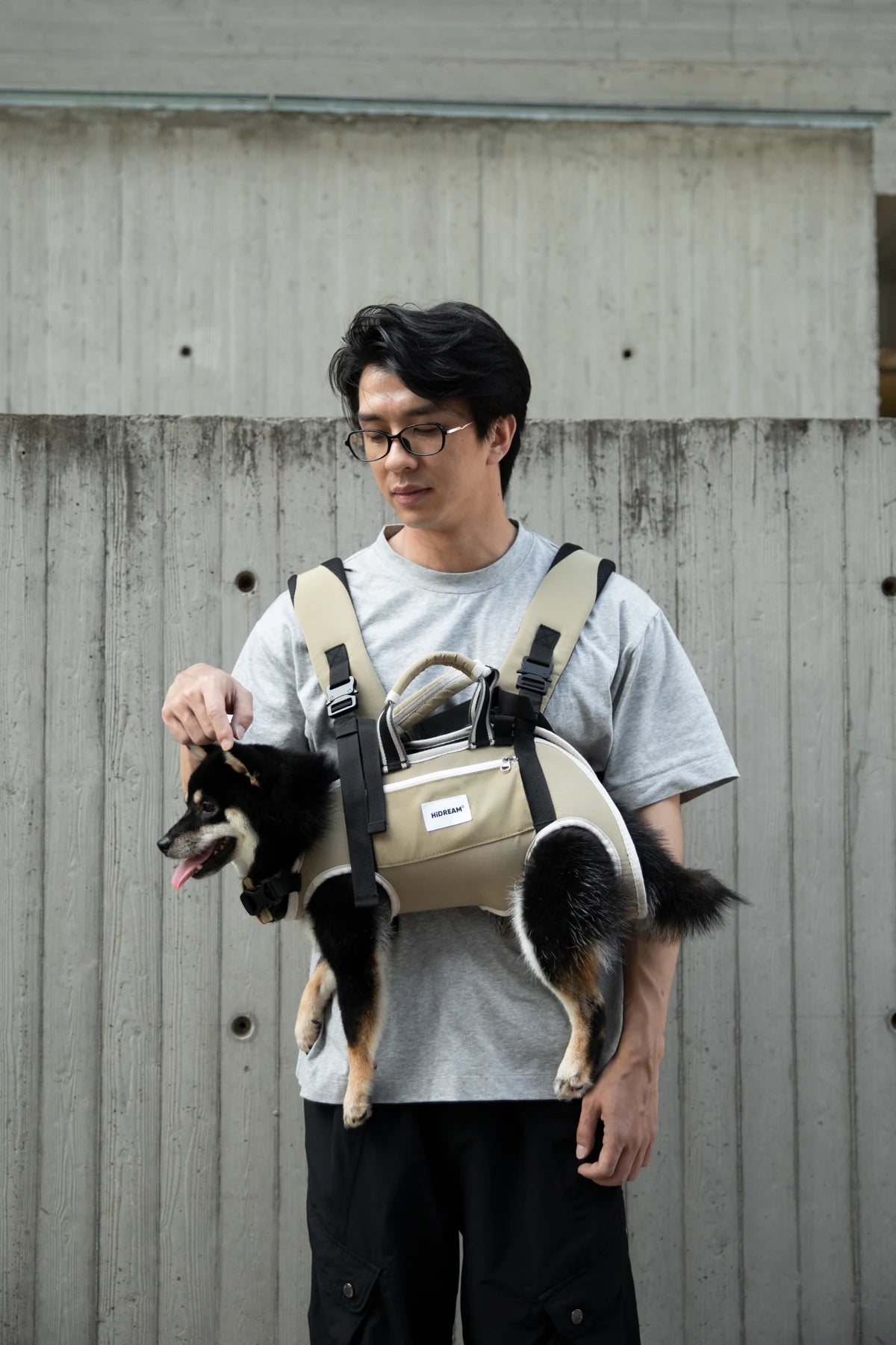 Deep Moss Green carrier worn in front with a dog