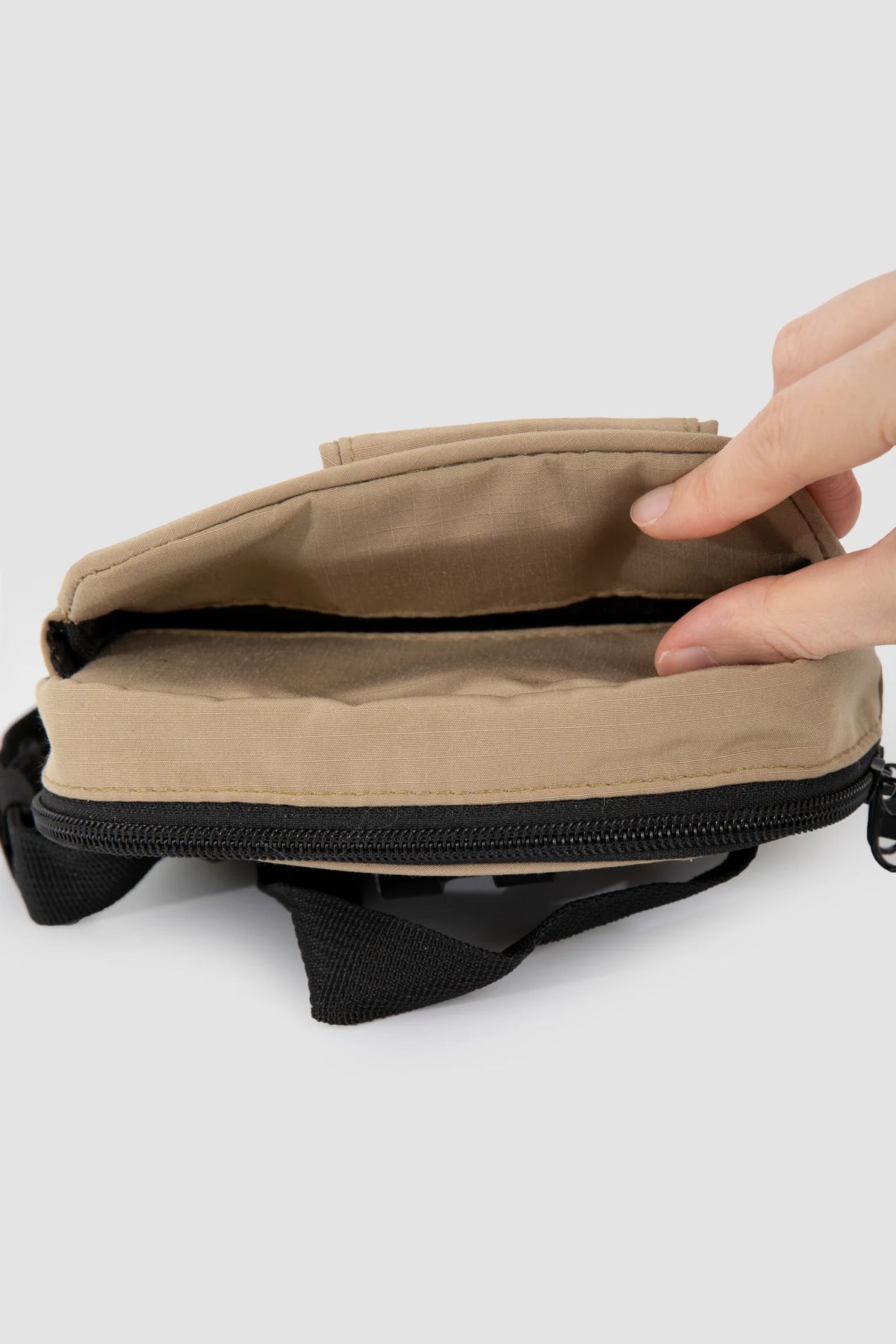 The open Clay Brown pouch interior