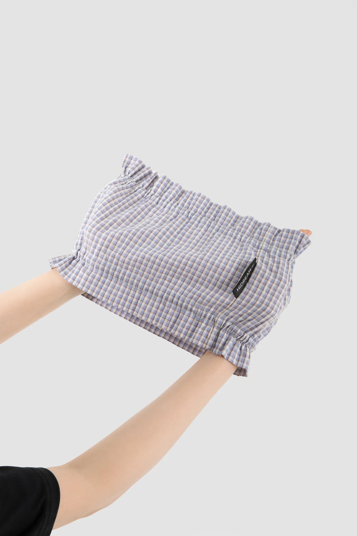 Mist Blue Check snood stretched gently between two hands