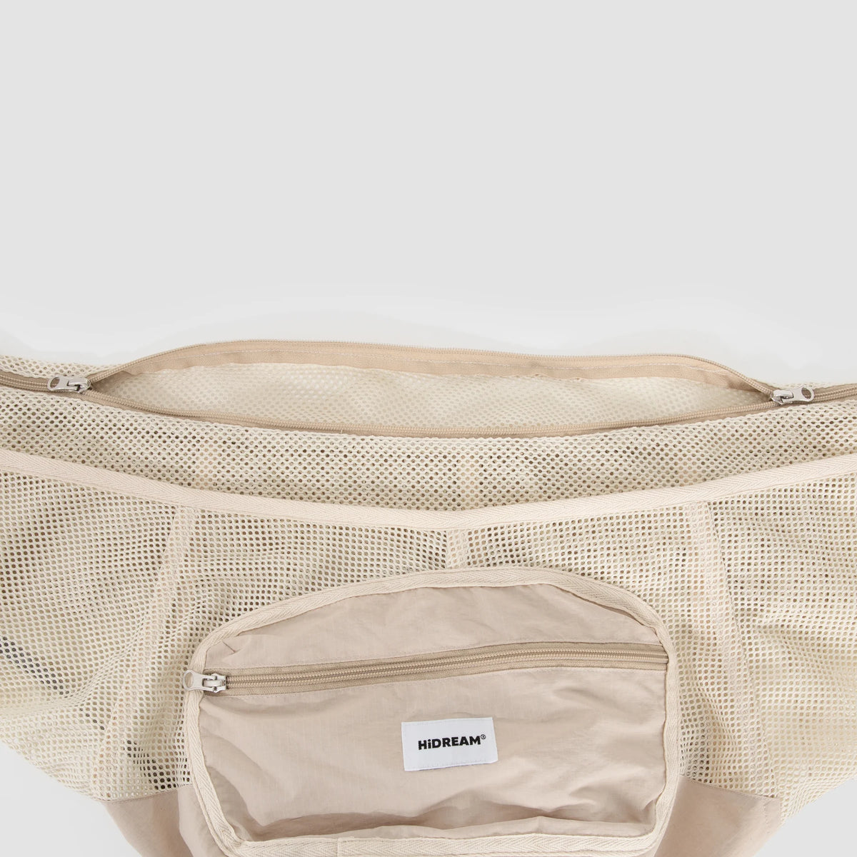 Front pocket on the Milk Tea Brown sling