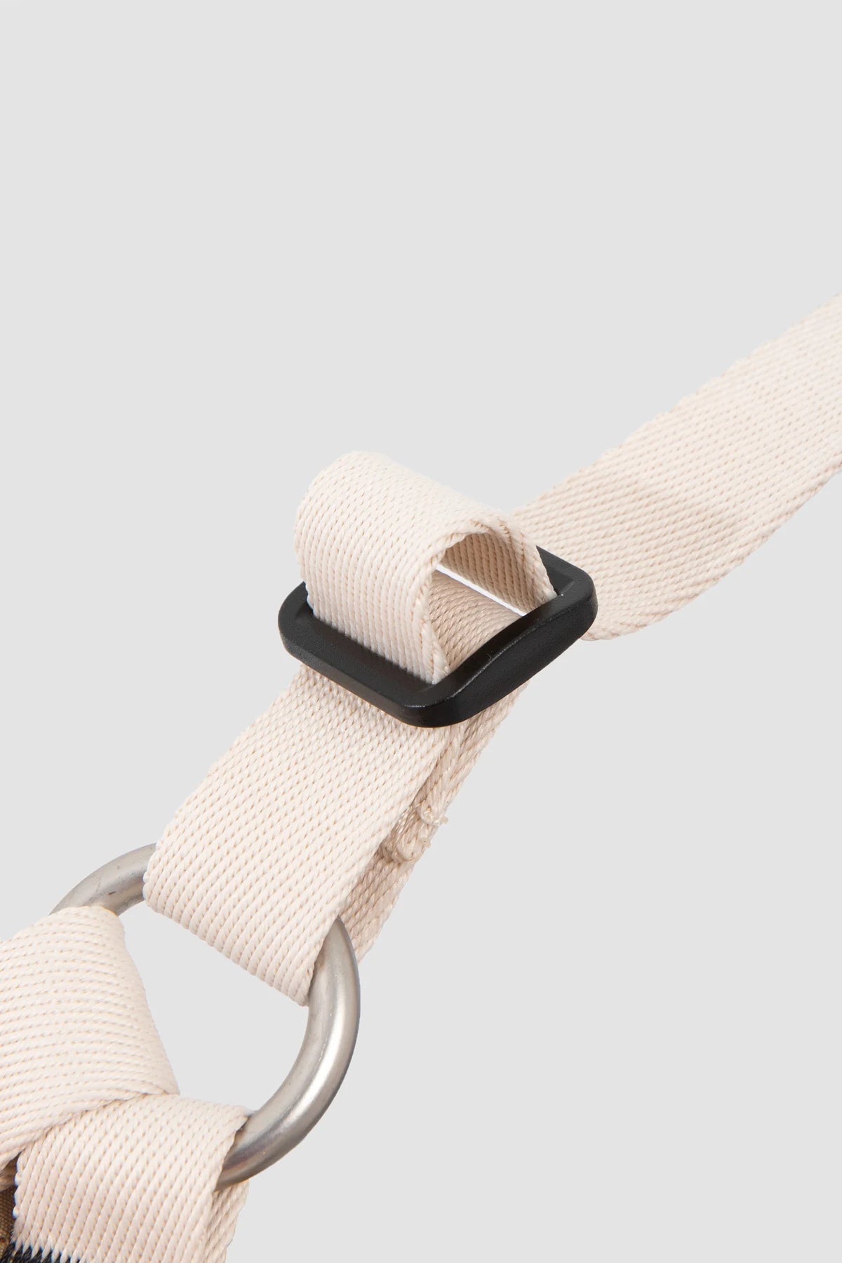 Webbing adjustment and metal attachment ring