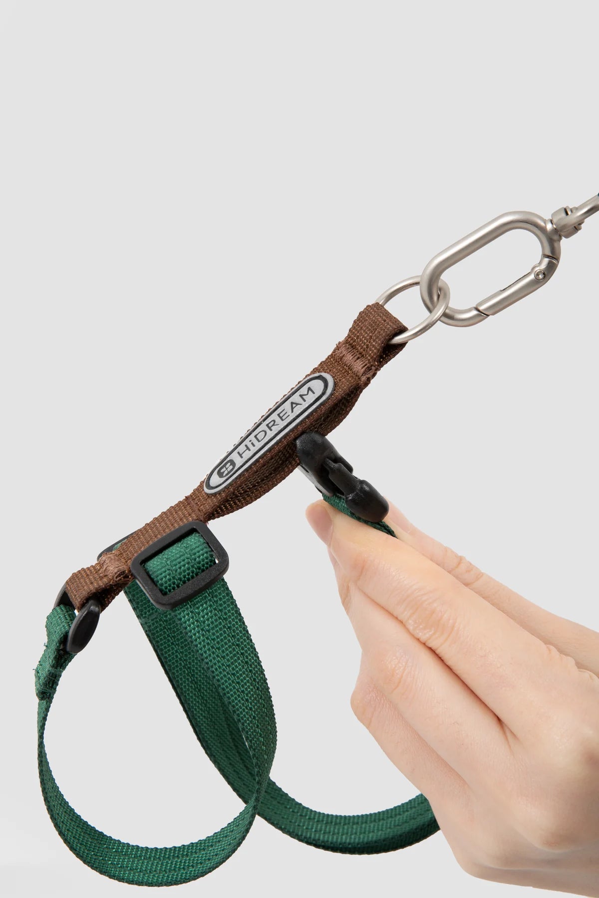 Adjustable sliders and leash attachment on the green Figure-Eight Cat Harness