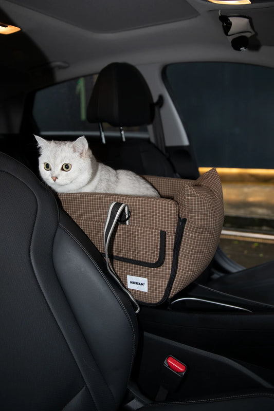 Brown Check console carrier positioned in a car with a cat inside