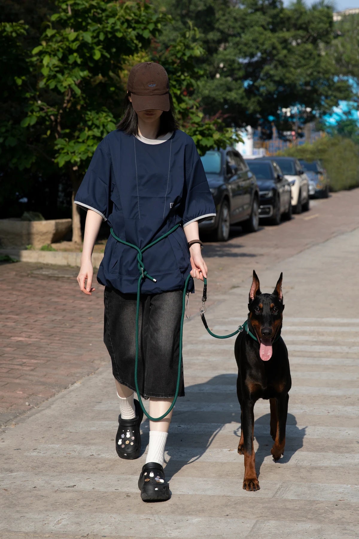 Owner walking a dog with the Turquoise Green rope collar and leash set