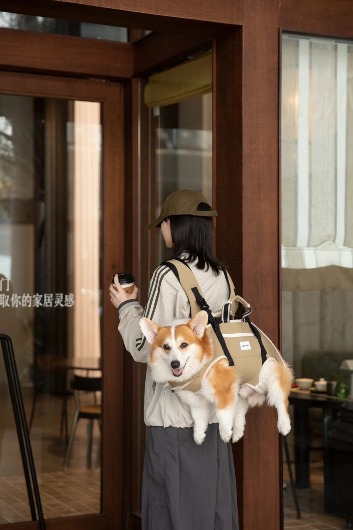 Terracotta Brown horizontal carrier worn on the back with a dog