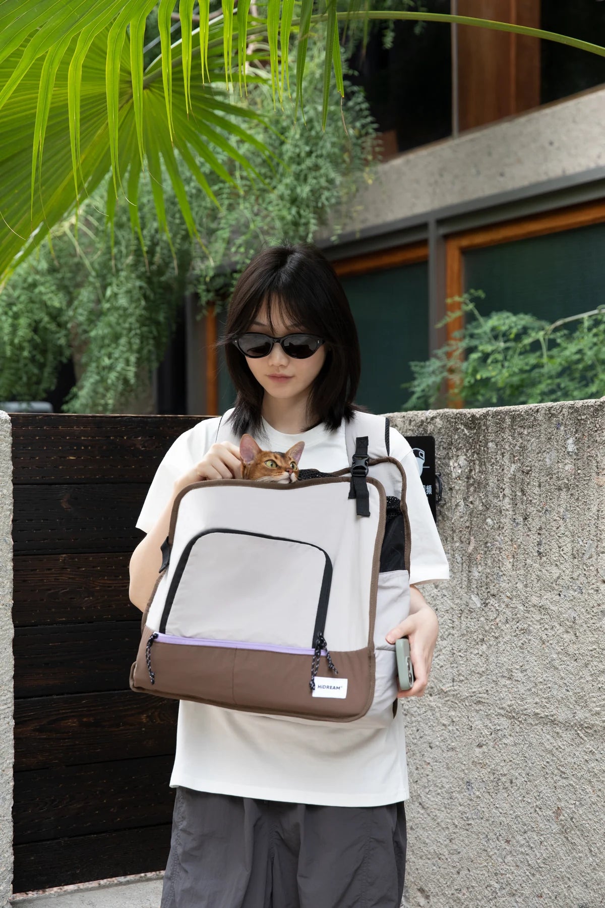 Owner wearing the Gray convertible carrier outdoors