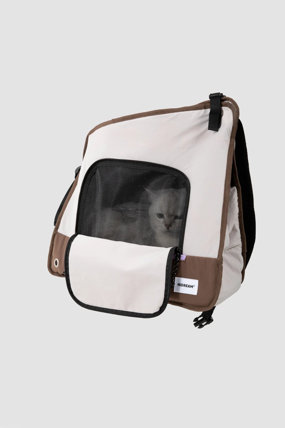Gray carrier with a cat visible through its front mesh