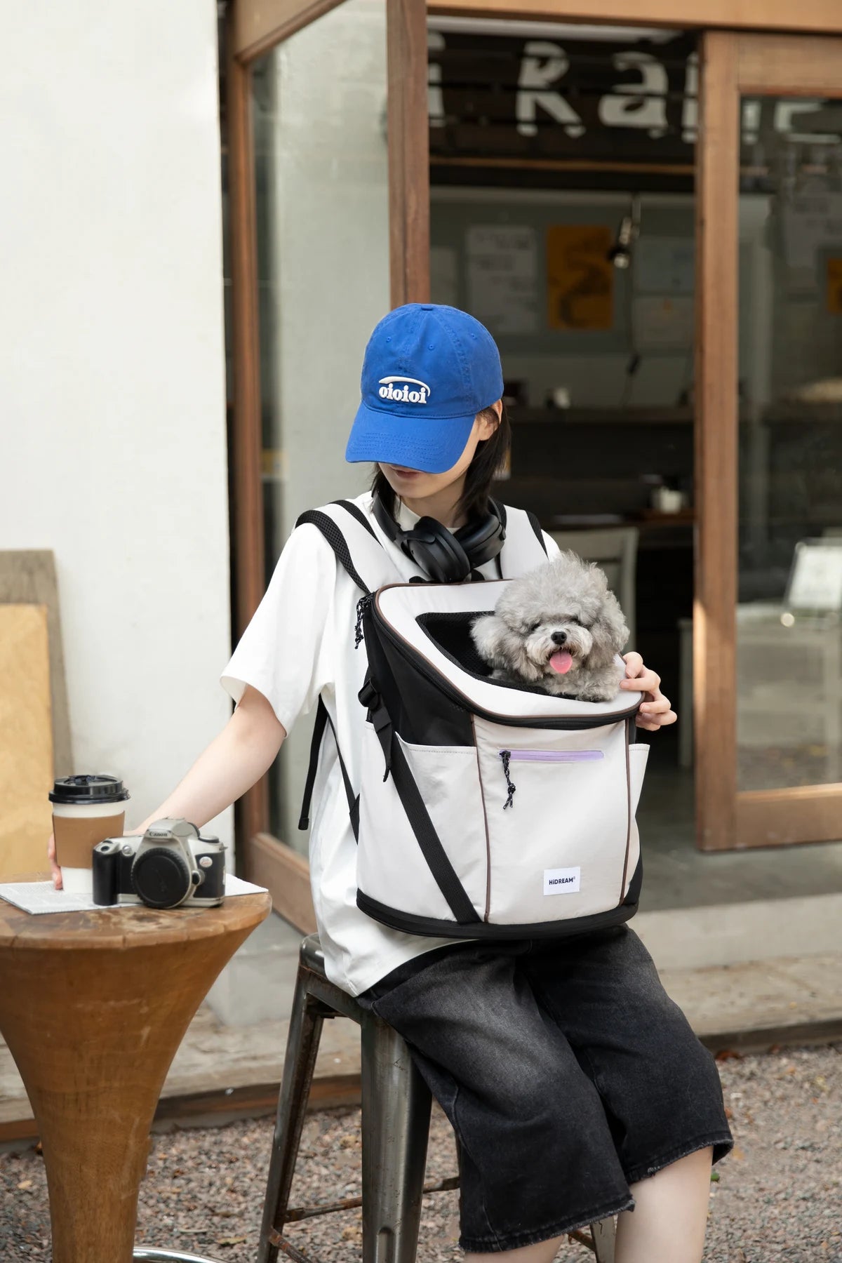 Owner and cat taking a pause outside the cafe