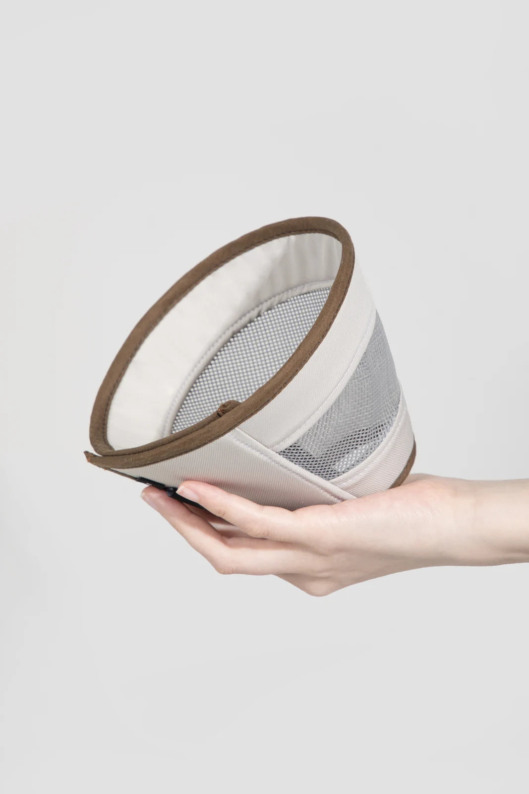Hand holding the flexible Beige cone