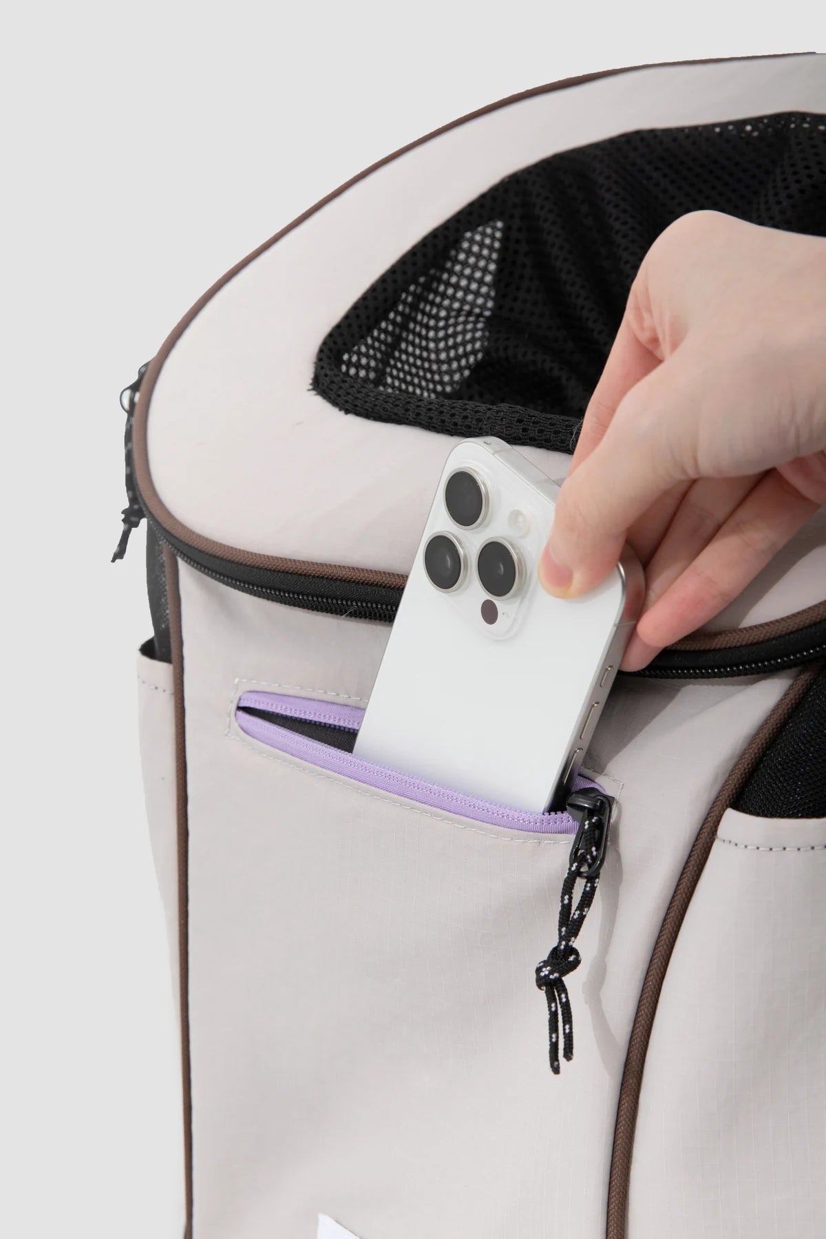 Phone placed in the Gray carrier front pocket