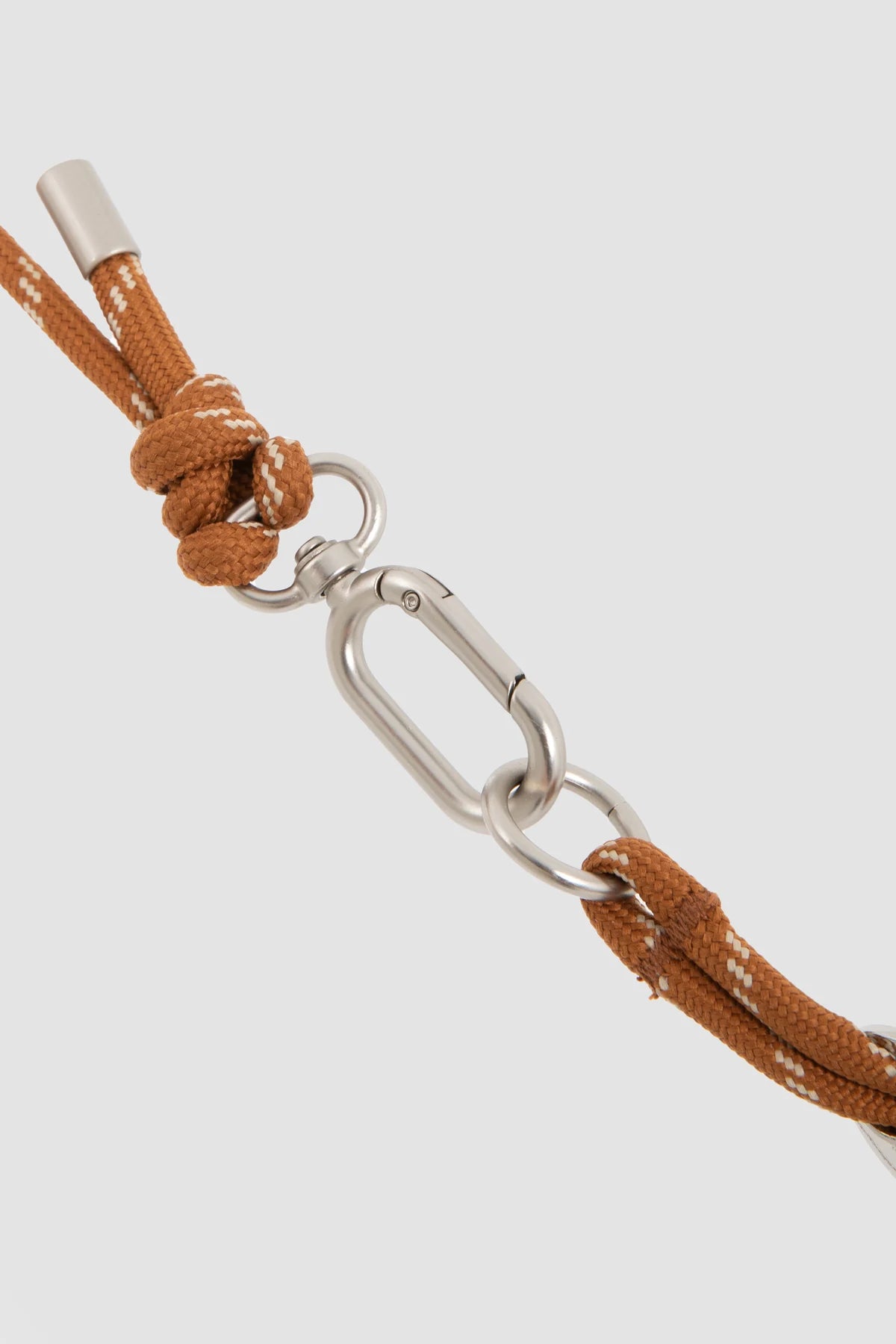 Metal clip attached to the harness ring