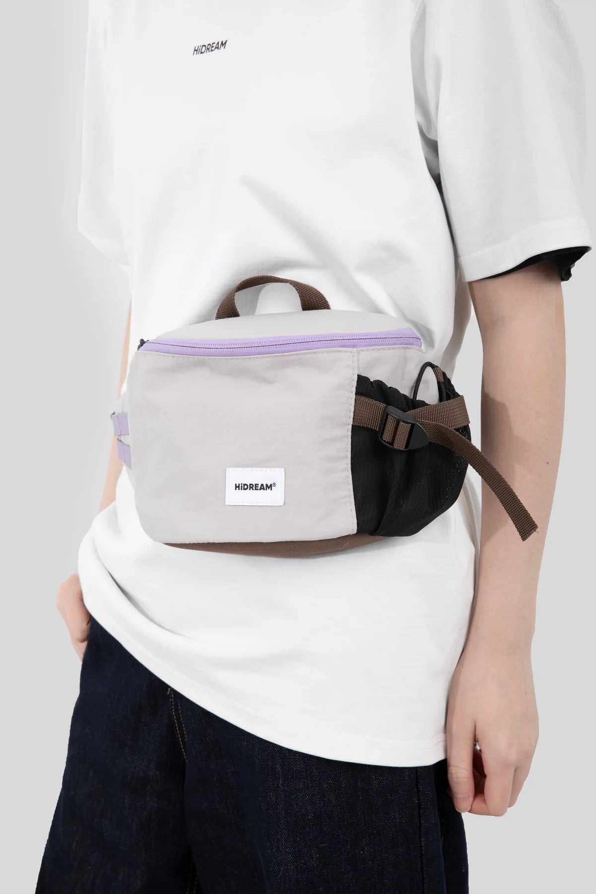 Front view of the Gray pack worn at the waist