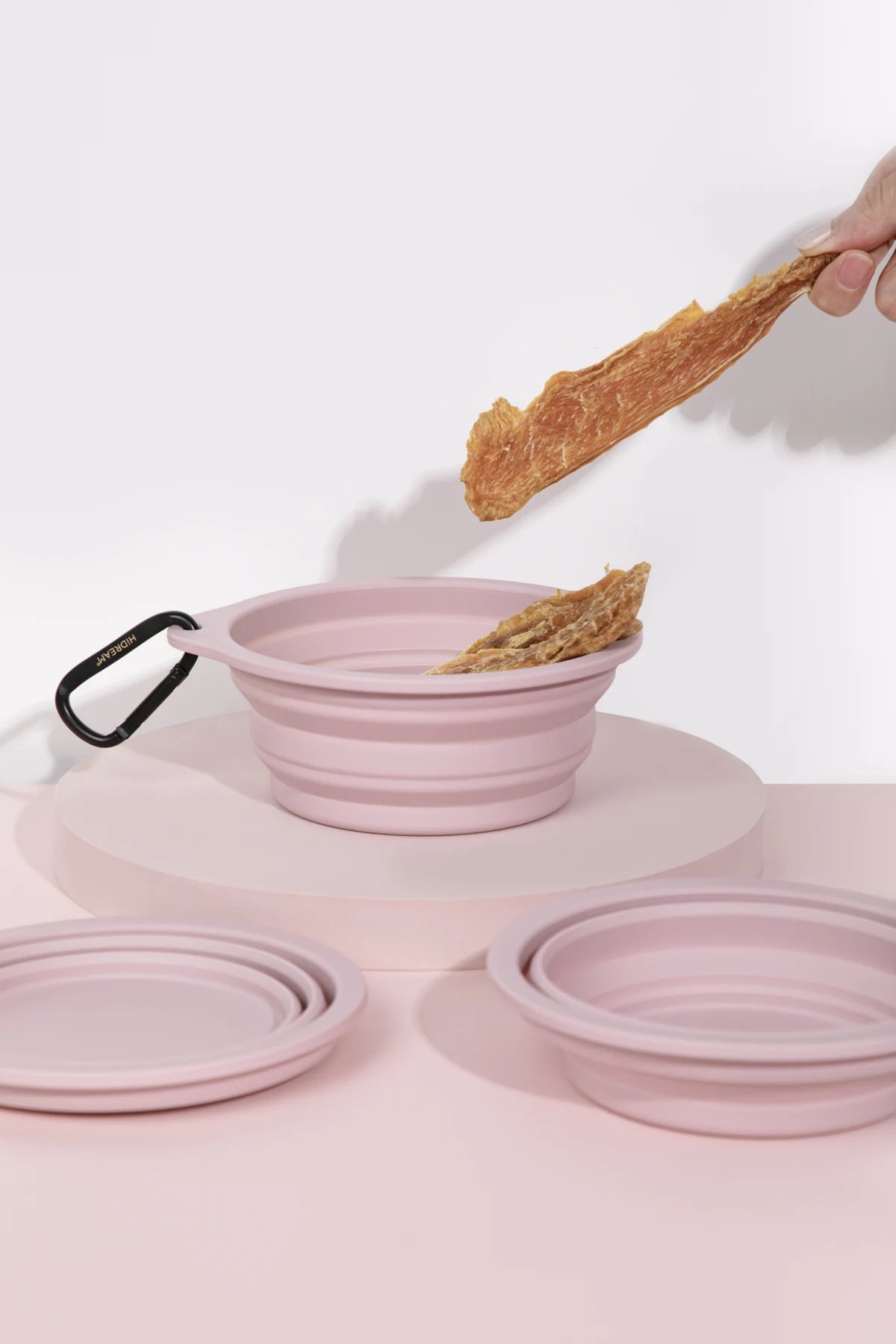 Pink product in a use or folding demonstration